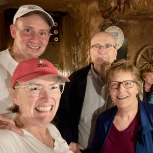 Retirement Travelers with another couple standing in a restaurant