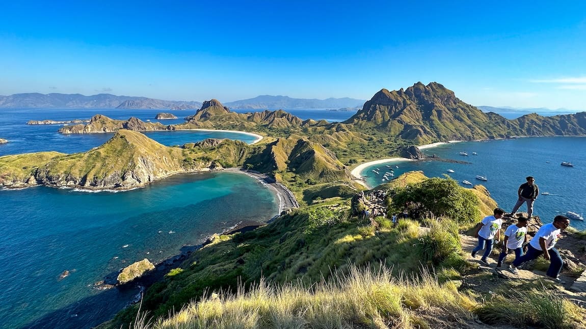 a picture of an island with beautiful greens and blues.