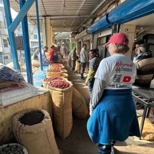 woman walking in spice souk in india