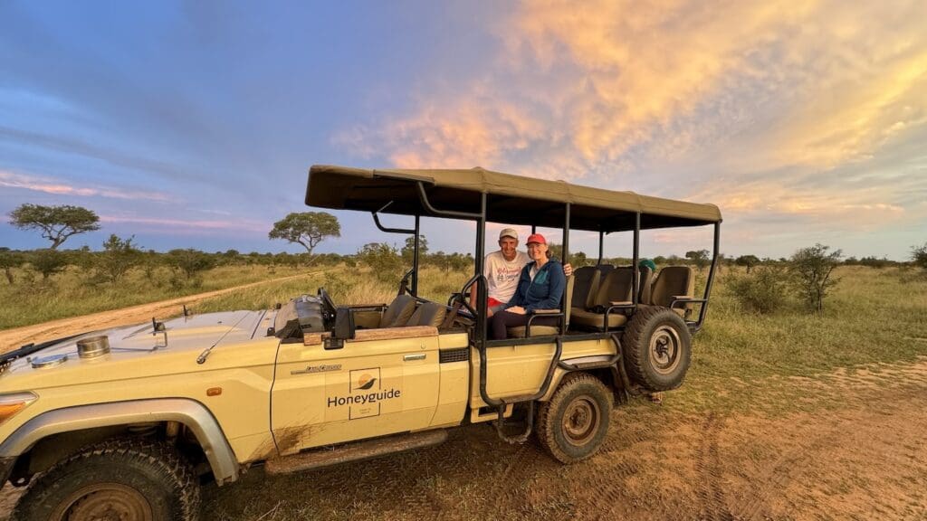 A safari jeep with John & Bev sitting in the back.