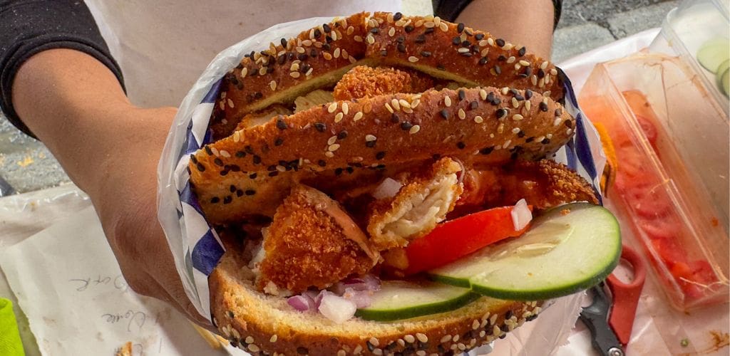 A huge chicken sandwich that is sold at Los Vaporcitos.