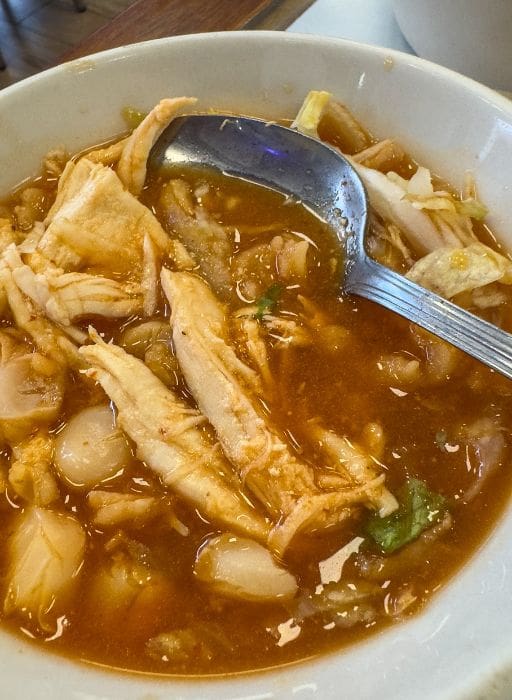 a soup with chicken and corn