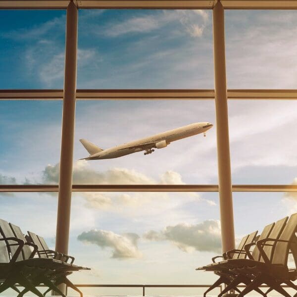 jet plane flying outside an airport
